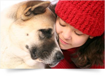 girl hugging dog