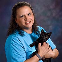 Clarisa Graham with a black kitten