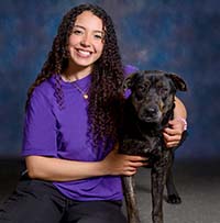 Jayva Smith, RVT Jayva Smith, RVT with a black dog